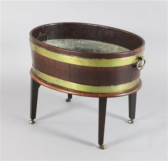 A George III brass bound mahogany oval wine cooler, W.2ft 1in. D.1ft 6in. H.1ft 7in.